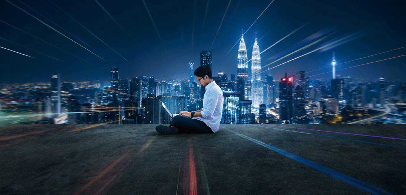 man using laptop on the rooftop at night man using laptop on the rooftop at night